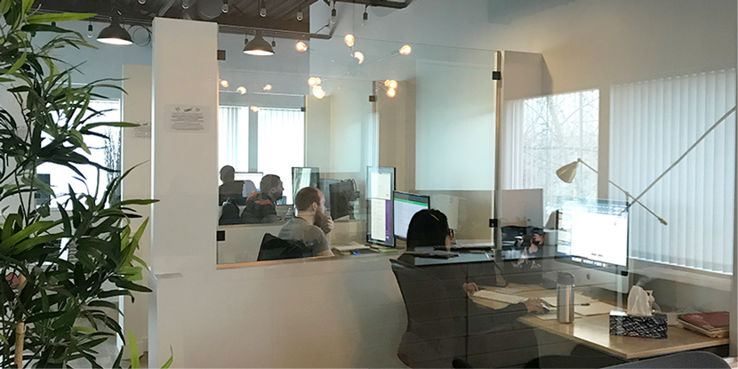 Picture of people working on computers at the Web3 office.