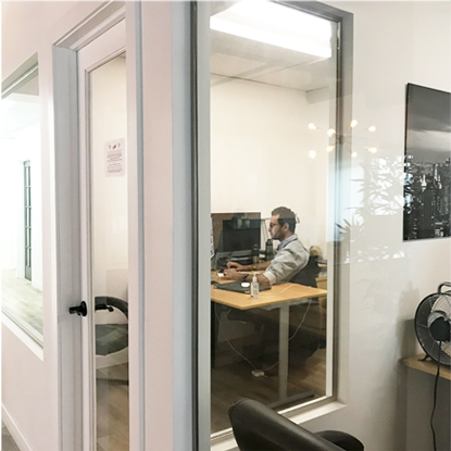 Designer worker in their office on a computer.
